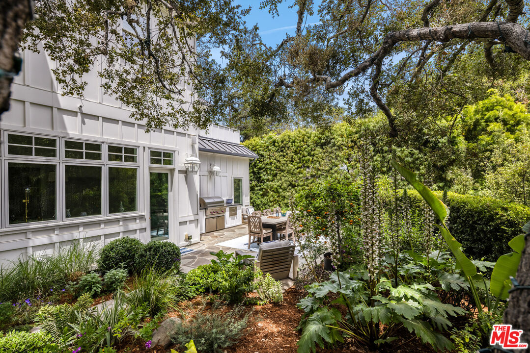 782 Ranch Lane Pacific Palisades, CA 90272 - Photo 48 of 53 front view of a house with a garden