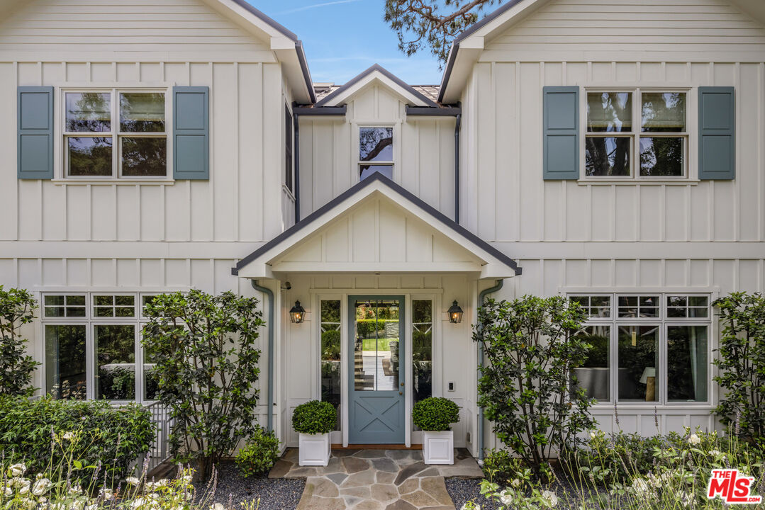782 Ranch Lane Pacific Palisades, CA 90272 - Photo 53 of 53 a view of a house with brick walls and potted plants