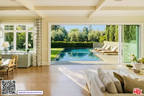a view of a living room and a floor to ceiling window