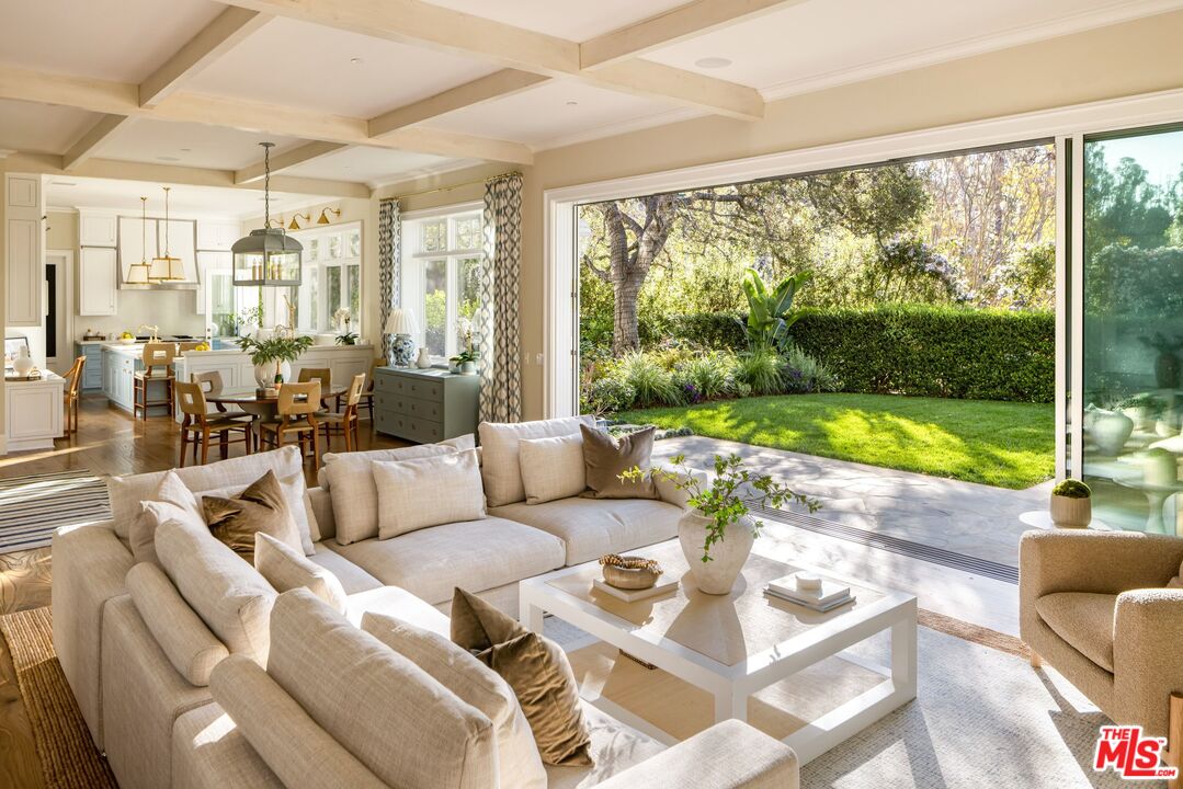 782 Ranch Lane Pacific Palisades, CA 90272 - Photo 6 of 53 a living room with furniture and a large window
