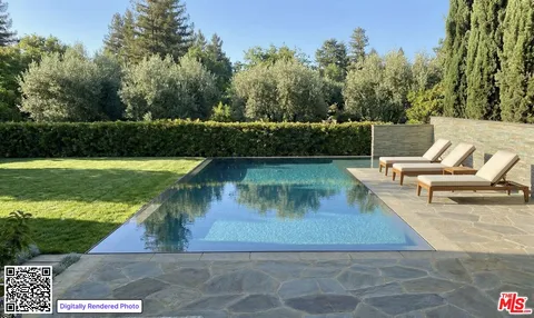 a living room with patio furniture and a garden