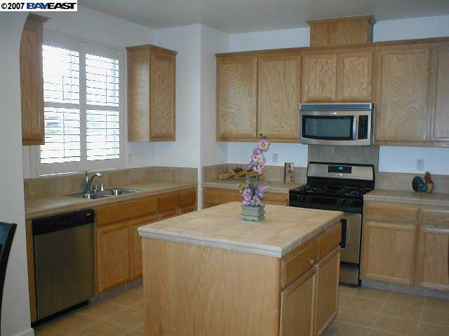 3412 Amaryllis Circle San Ramon, CA 94582 - Photo 3 of 9 a kitchen with a sink a stove and cabinets