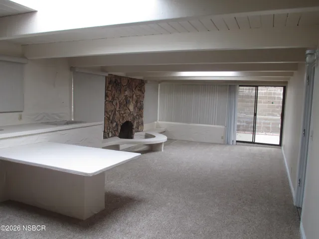 a living room with fireplace furniture and a fireplace