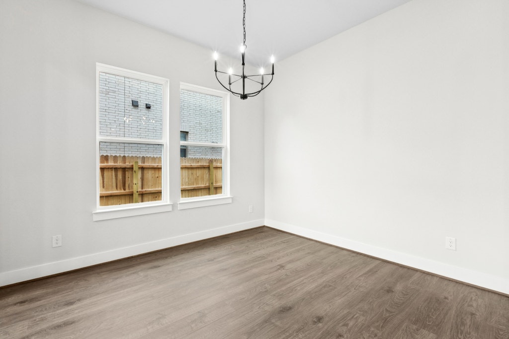 19600 Judys View Pflugerville, TX 78660 - Photo 8 of 34 a view of empty room with wooden floor and fan