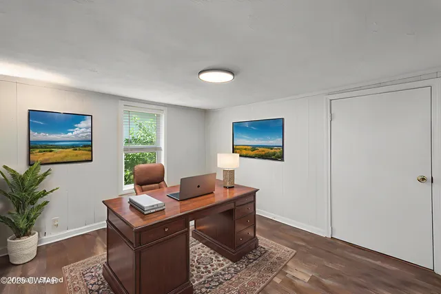 a workspace with furniture and window