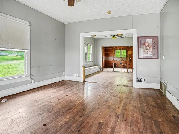 a view of room with window and hardwood floor