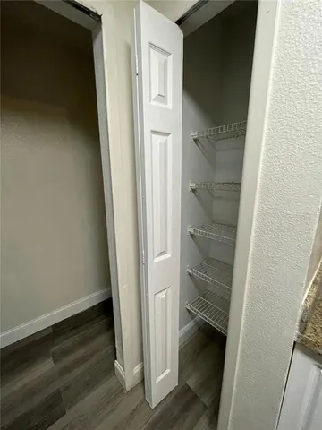 a view of entryway with wooden floor