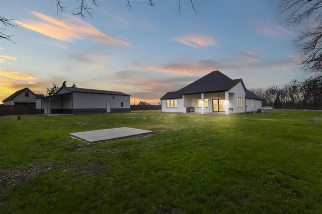 a view of a house with a big yard