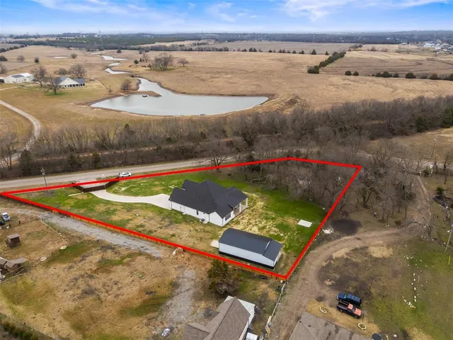 a view of a pool in front of the house
