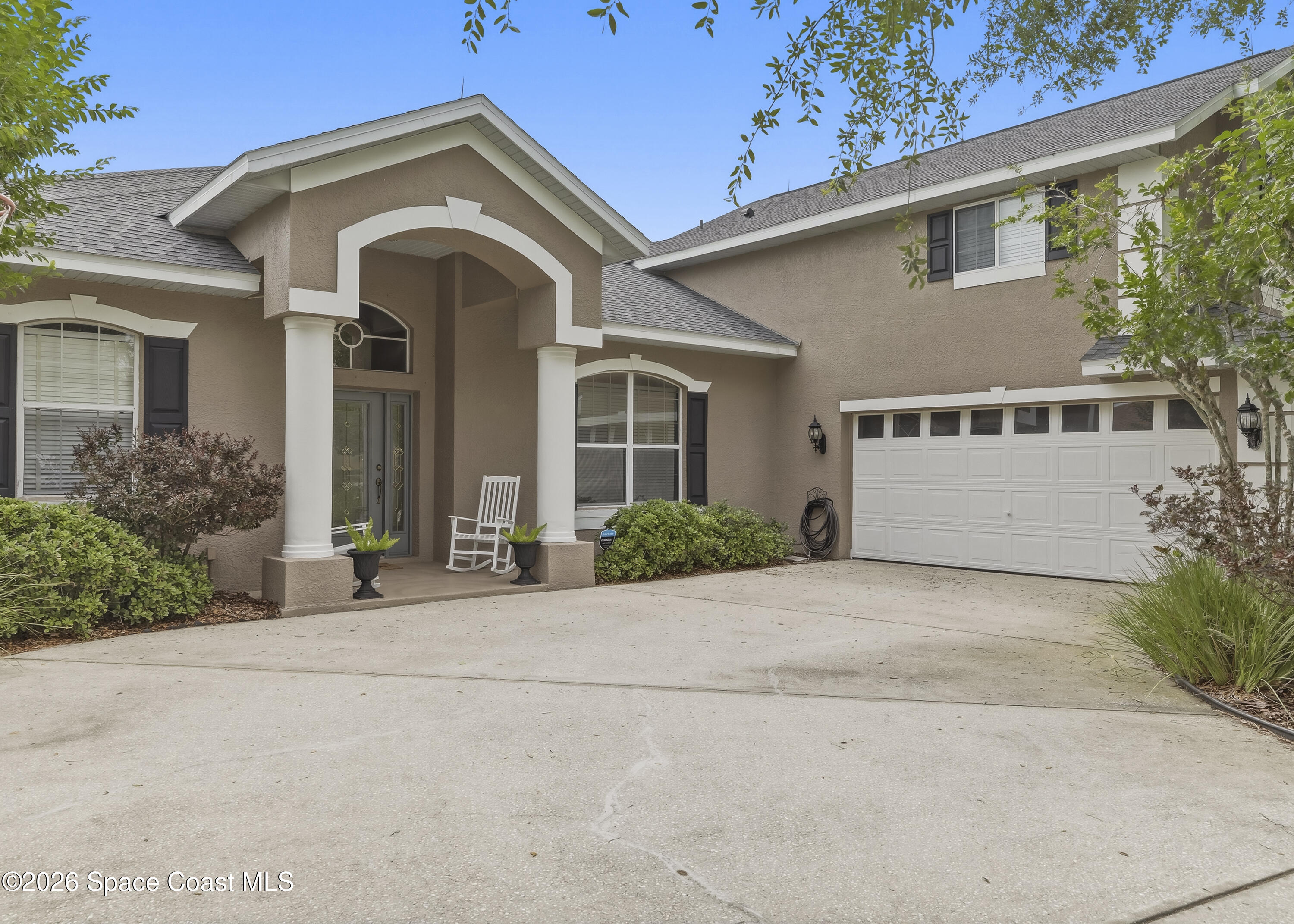 1643 Long Pine Road Melbourne, FL 32940 - Photo 4 of 63 front view of a house with a yard