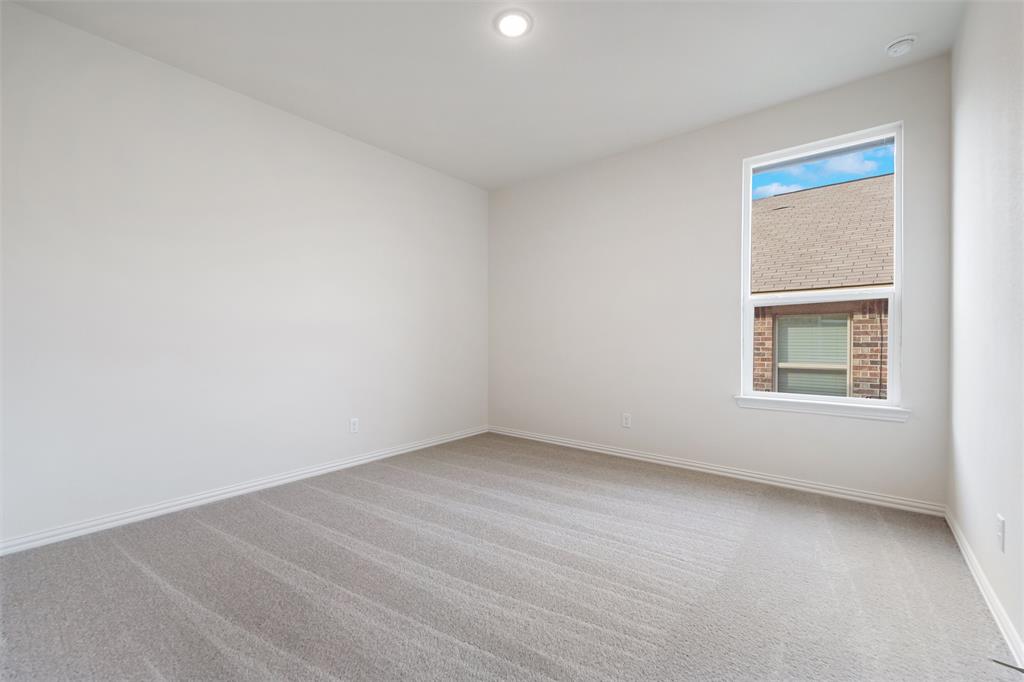 3508 Columbus Street Gainesville, TX 76240 - Photo 15 of 38 an empty room with a window