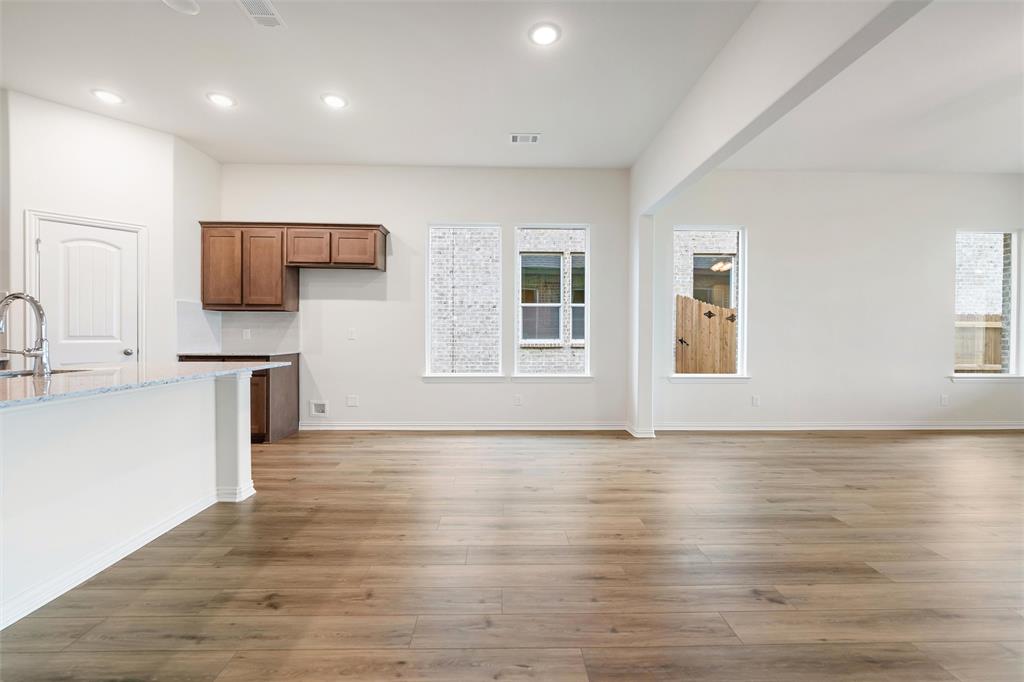 3508 Columbus Street Gainesville, TX 76240 - Photo 19 of 38 a view of kitchen with wooden floor and electronic appliances