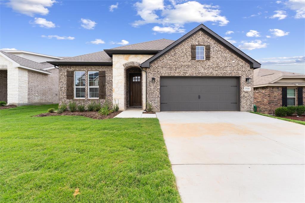 3508 Columbus Street Gainesville, TX 76240 - Photo 2 of 38 a front view of a house with garden