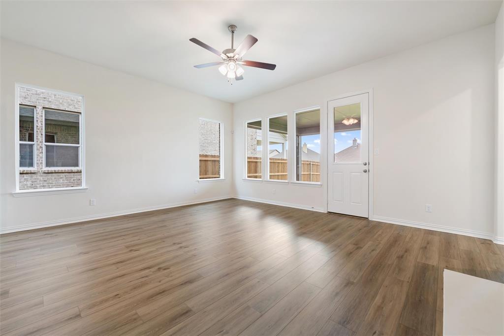 3508 Columbus Street Gainesville, TX 76240 - Photo 21 of 38 a view of an empty room with wooden floor and a window