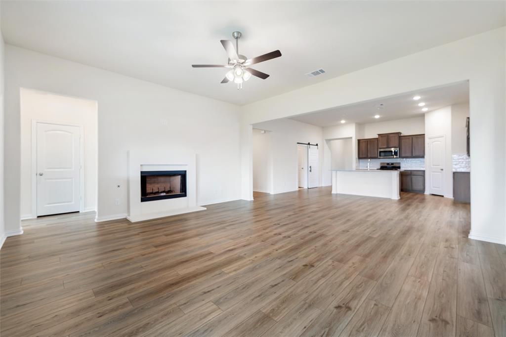 3508 Columbus Street Gainesville, TX 76240 - Photo 22 of 38 a view of kitchen and hall with wooden floor