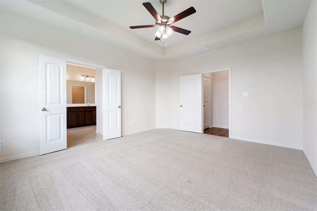 3508 Columbus Street Gainesville, TX 76240 - Photo 25 of 38 a view of an empty room with a ceiling fan