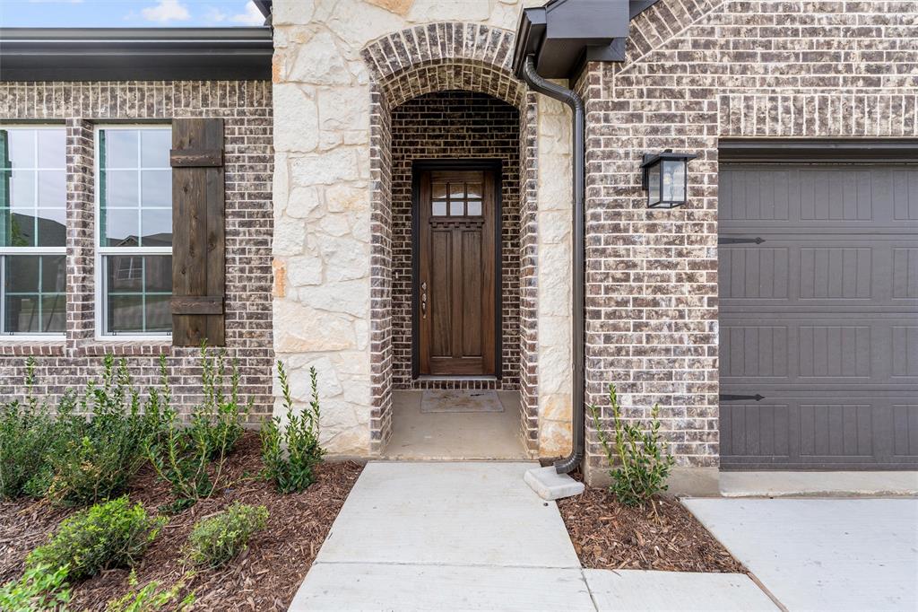 3508 Columbus Street Gainesville, TX 76240 - Photo 7 of 38 a front view of a house with a door