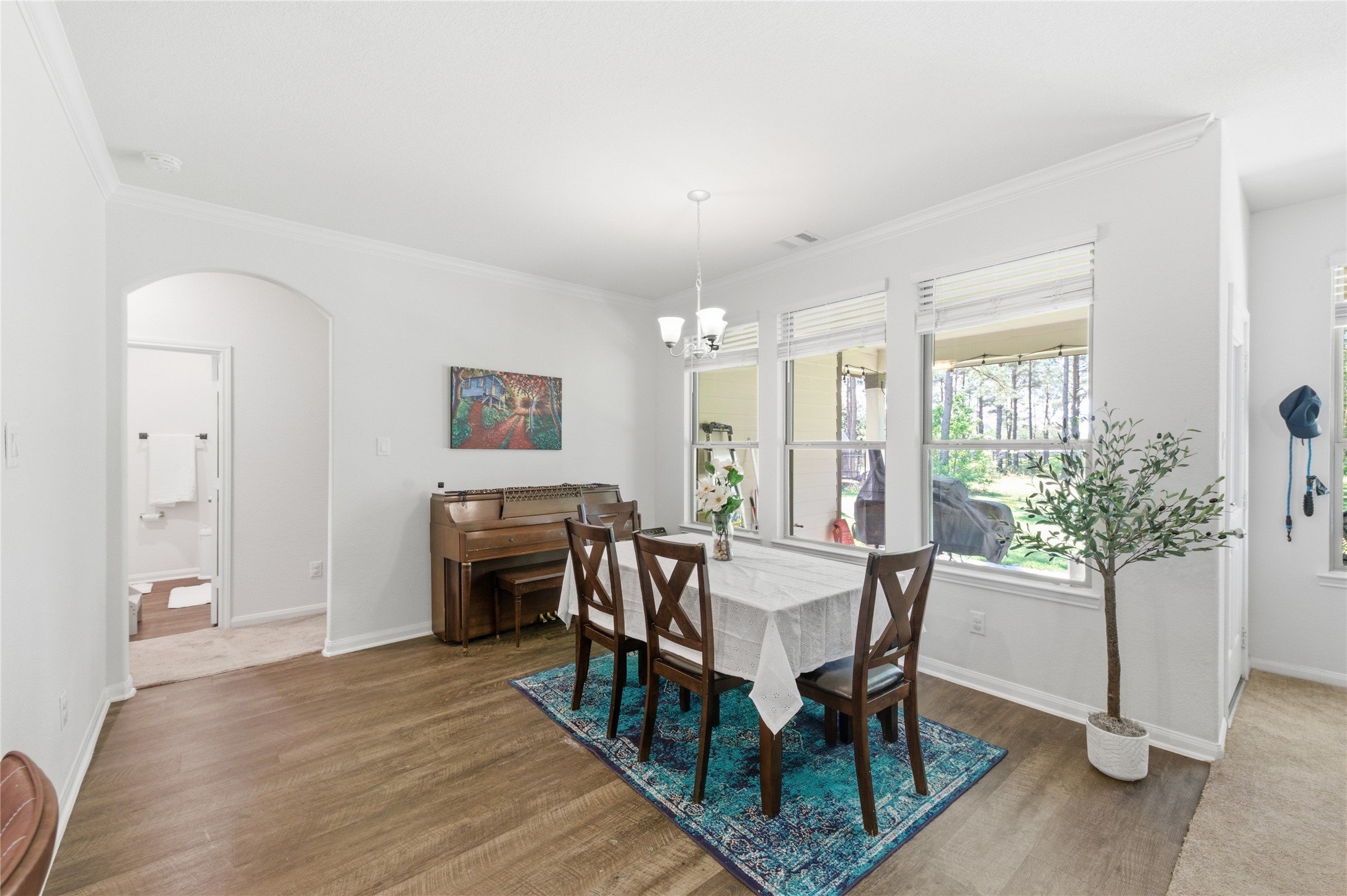 16536 Aransas Conroe, TX 77303 - Photo 10 of 40 a view of a dining room with furniture window and wooden floor