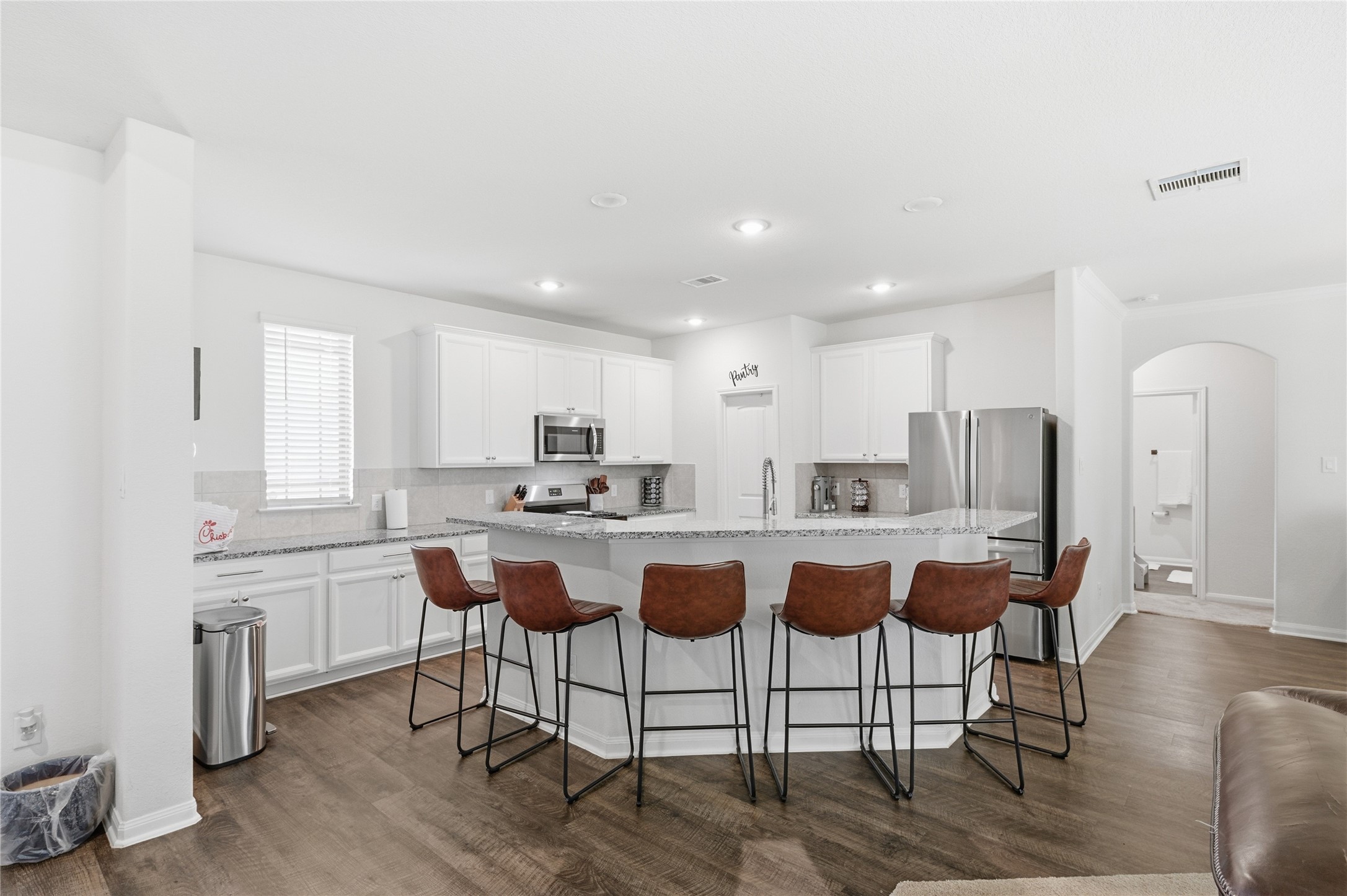 16536 Aransas Conroe, TX 77303 - Photo 15 of 40 a kitchen with stainless steel appliances granite countertop a table chairs sink and cabinets