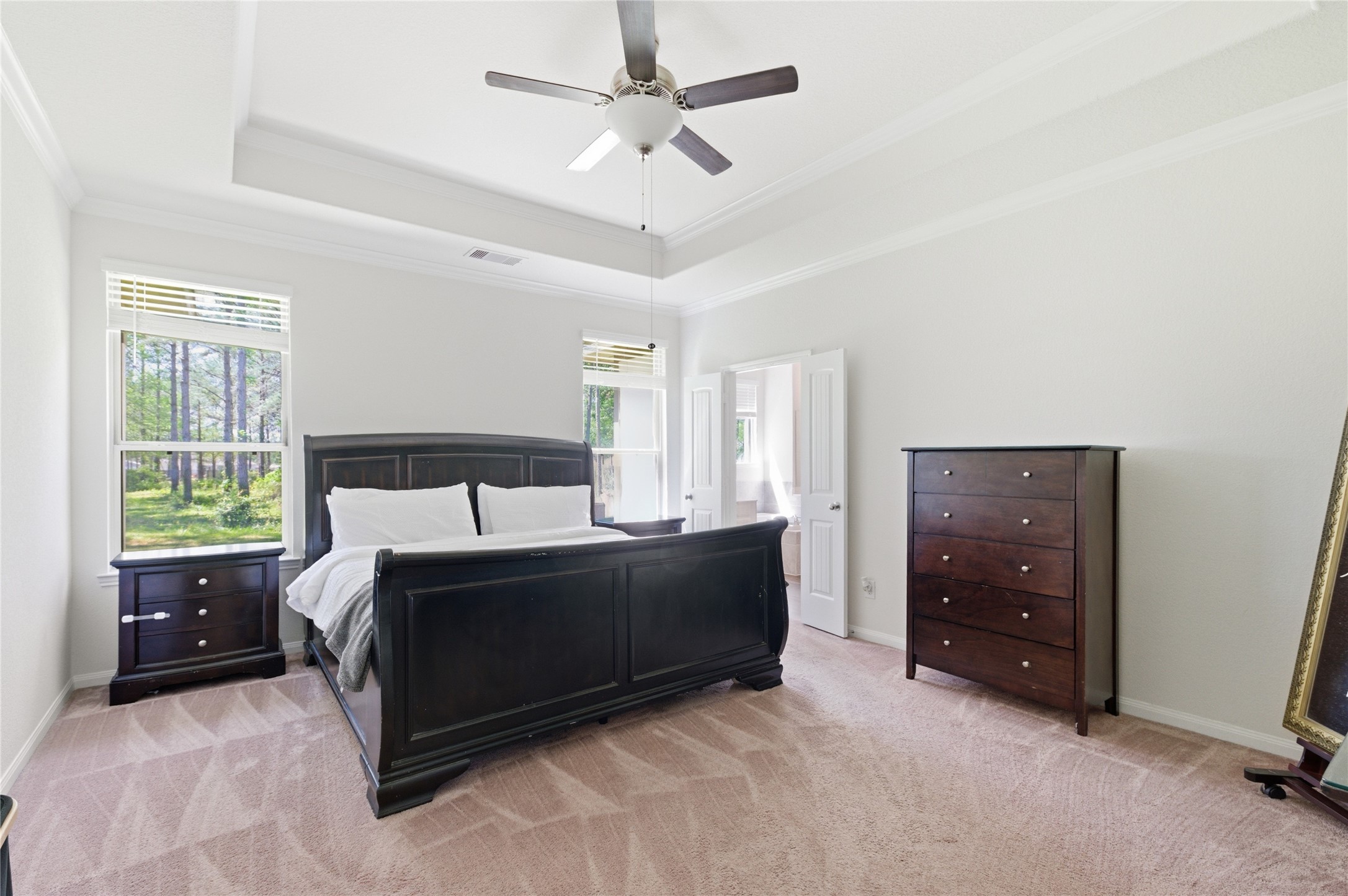16536 Aransas Conroe, TX 77303 - Photo 19 of 40 a bed room with a bed and a ceiling fan