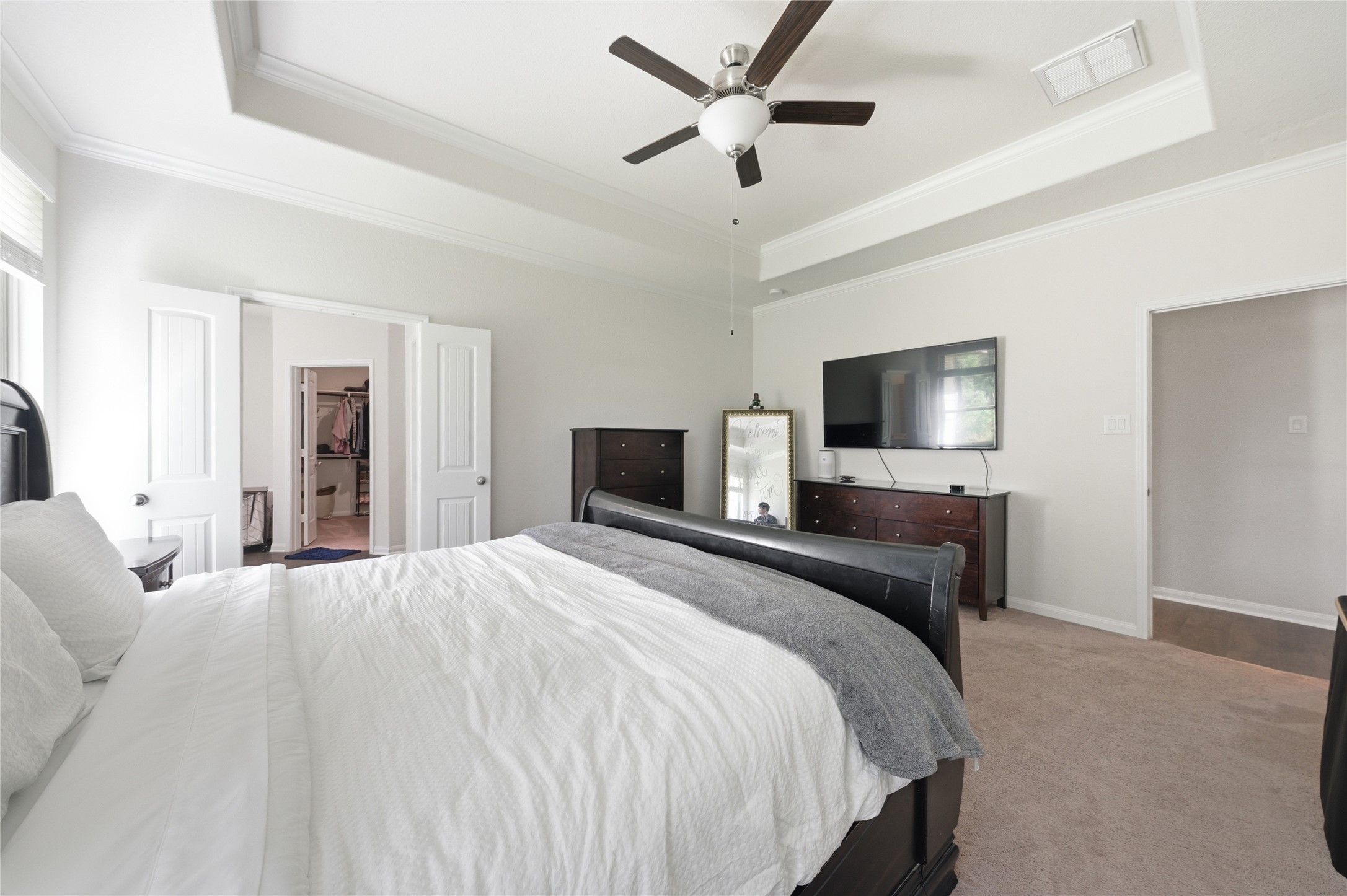16536 Aransas Conroe, TX 77303 - Photo 20 of 40 a bedroom with a bed and a flat screen tv