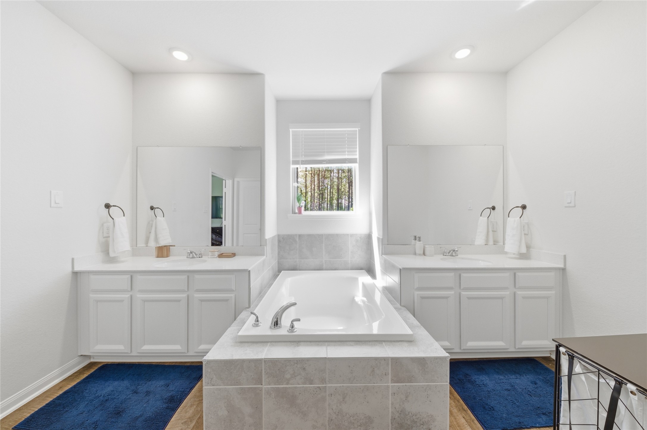 16536 Aransas Conroe, TX 77303 - Photo 22 of 40 a spacious bathroom with a sink double vanity granite and a mirror