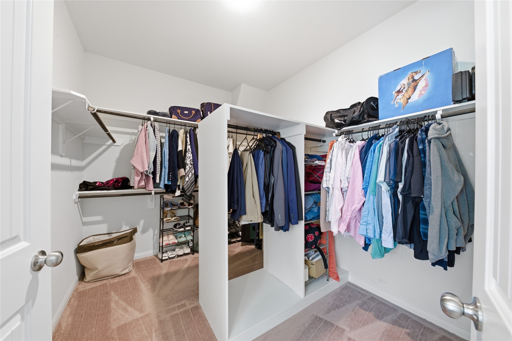 16536 Aransas Conroe, TX 77303 - Photo 24 of 40 a view of walk in closet with clothes and shoes