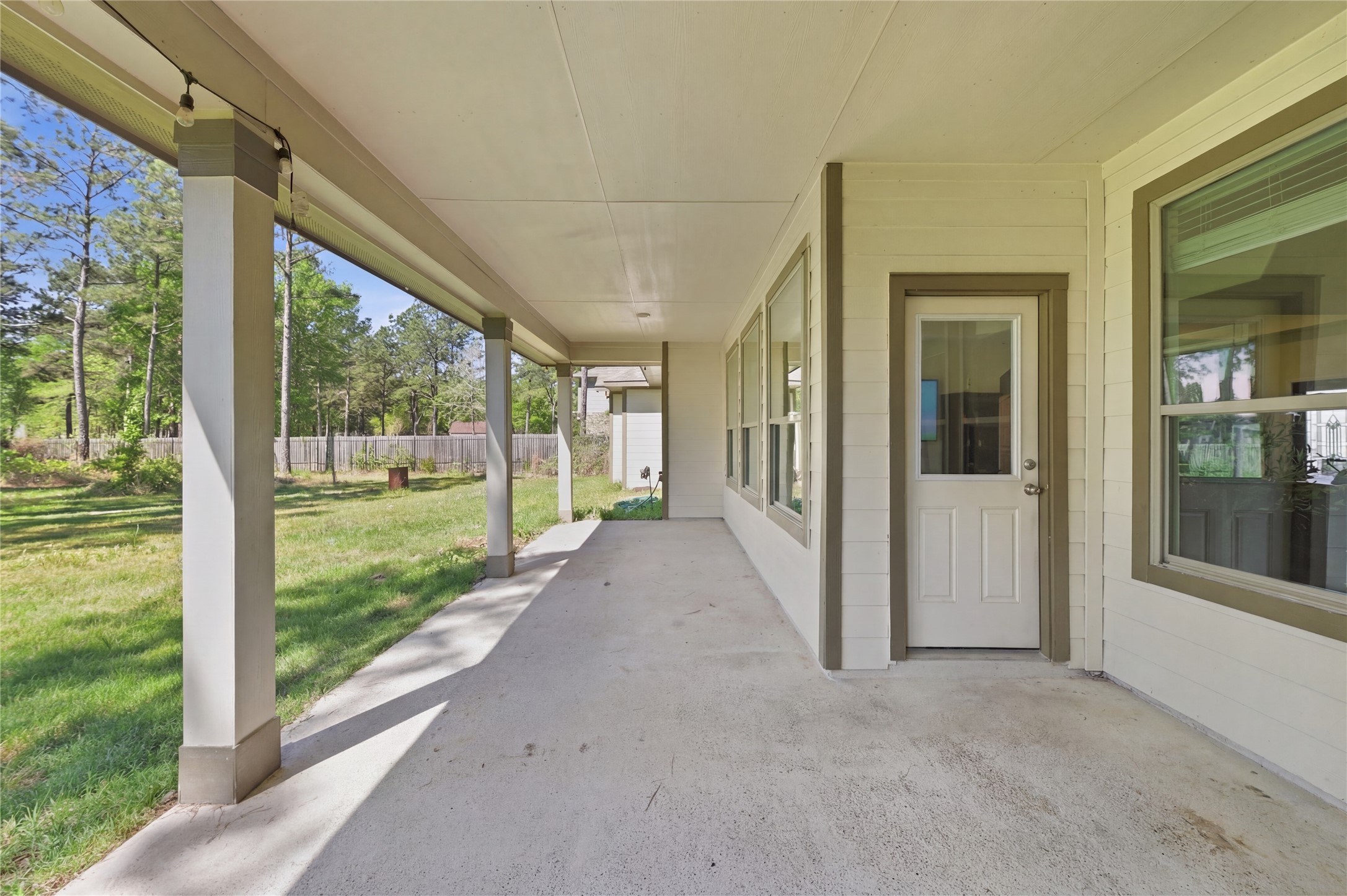 16536 Aransas Conroe, TX 77303 - Photo 30 of 40 a view of a porch with a yard