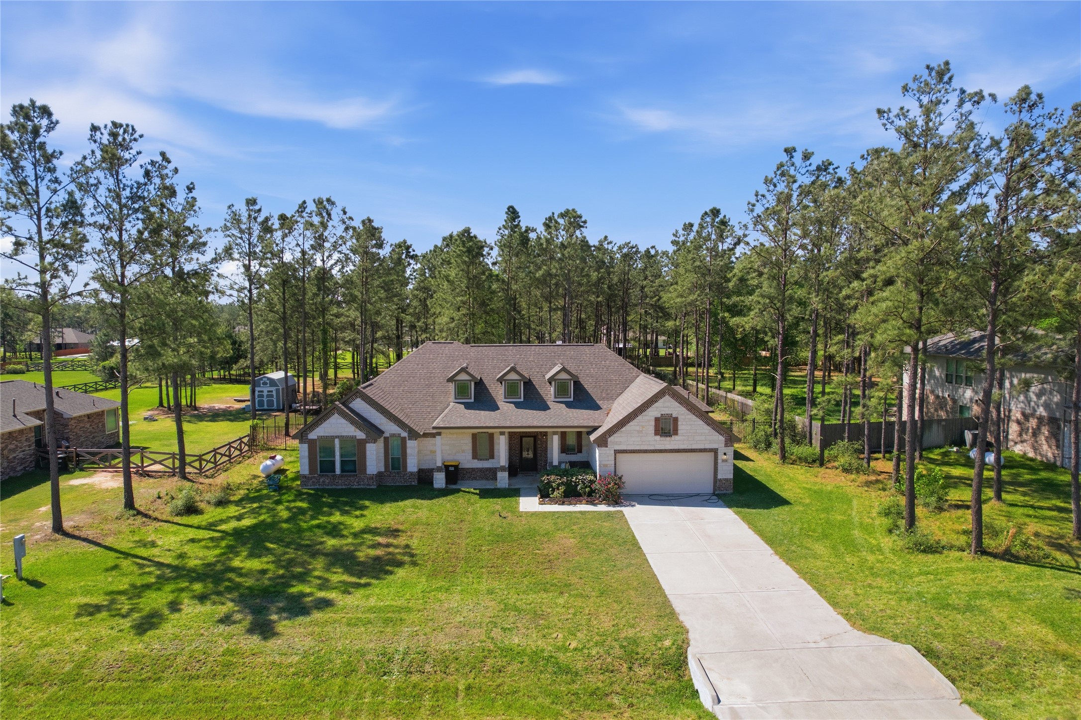 16536 Aransas Conroe, TX 77303 - Photo 33 of 40 a aerial view of a house with swimming pool and big yard