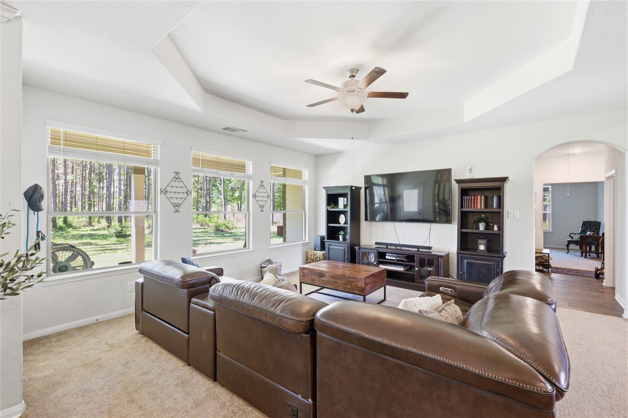 16536 Aransas Conroe, TX 77303 - Photo 6 of 40 a living room with furniture and a flat screen tv