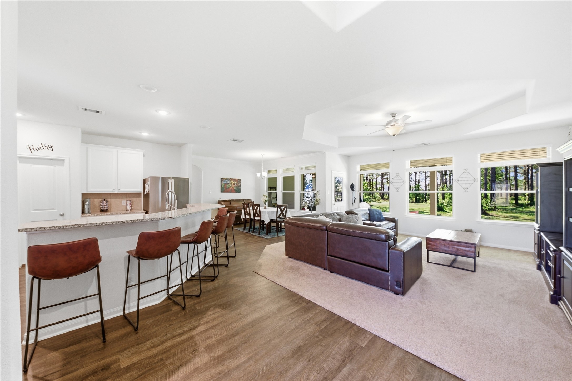 16536 Aransas Conroe, TX 77303 - Photo 7 of 40 a living room with furniture kitchen view and a large window