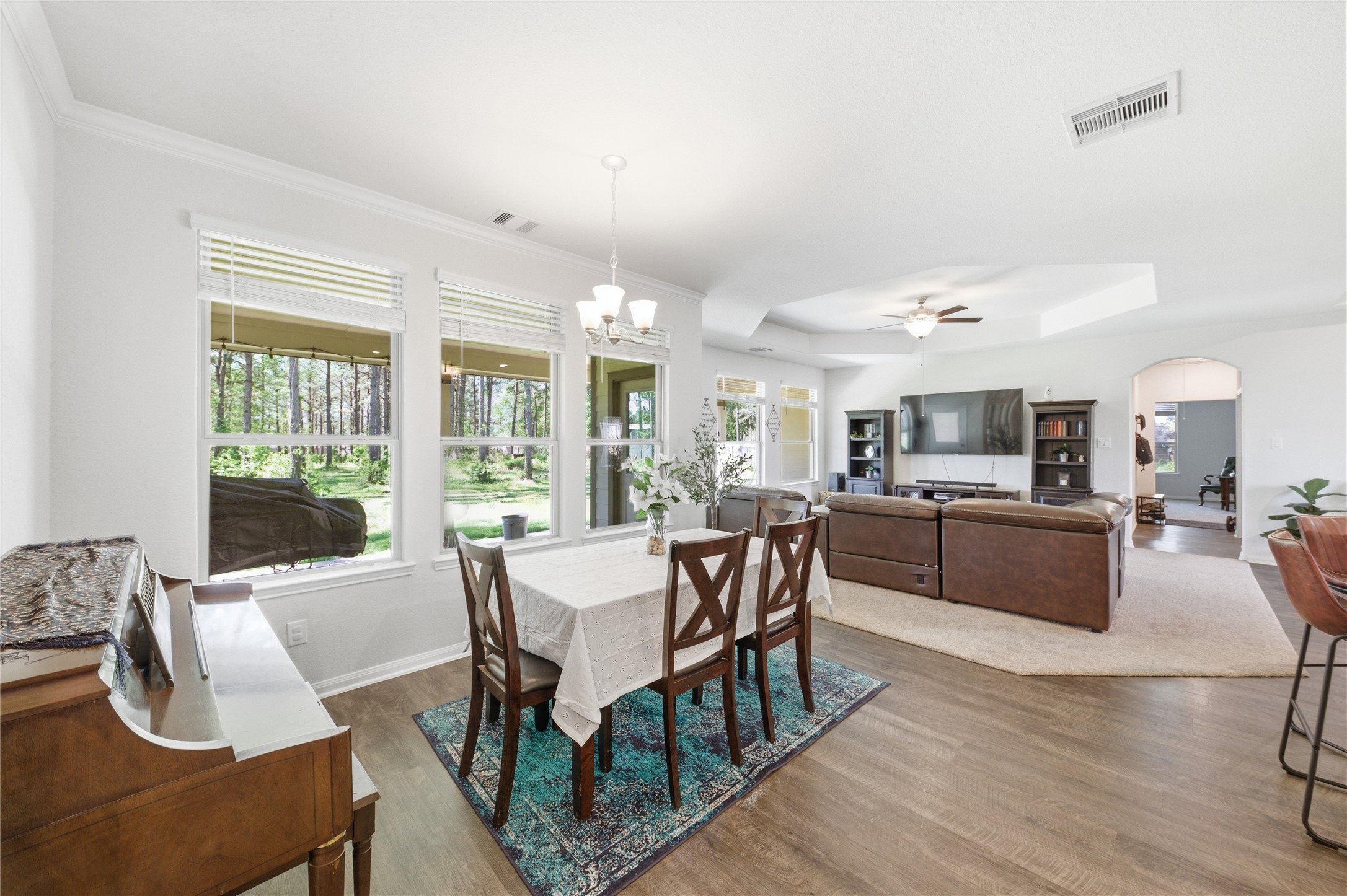 16536 Aransas Conroe, TX 77303 - Photo 9 of 40 a view of a dining room with furniture window and wooden floor