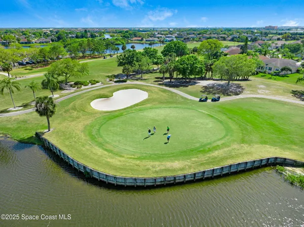 a dining room with furniture and chandelier