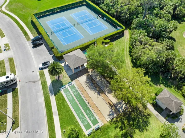 a view of a backyard with sitting area