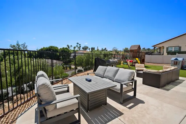 a view of a terrace with furniture