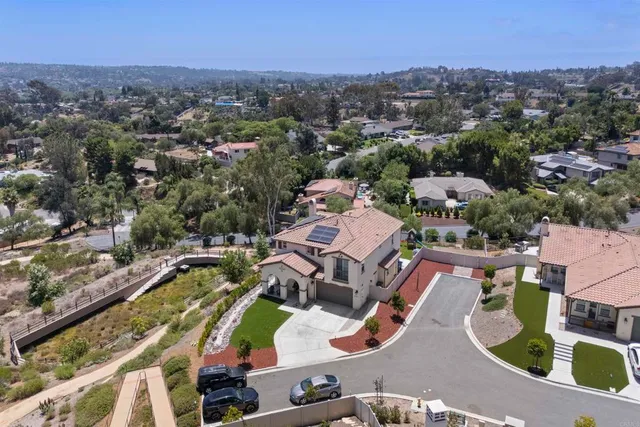 an aerial view of residential houses with outdoor space