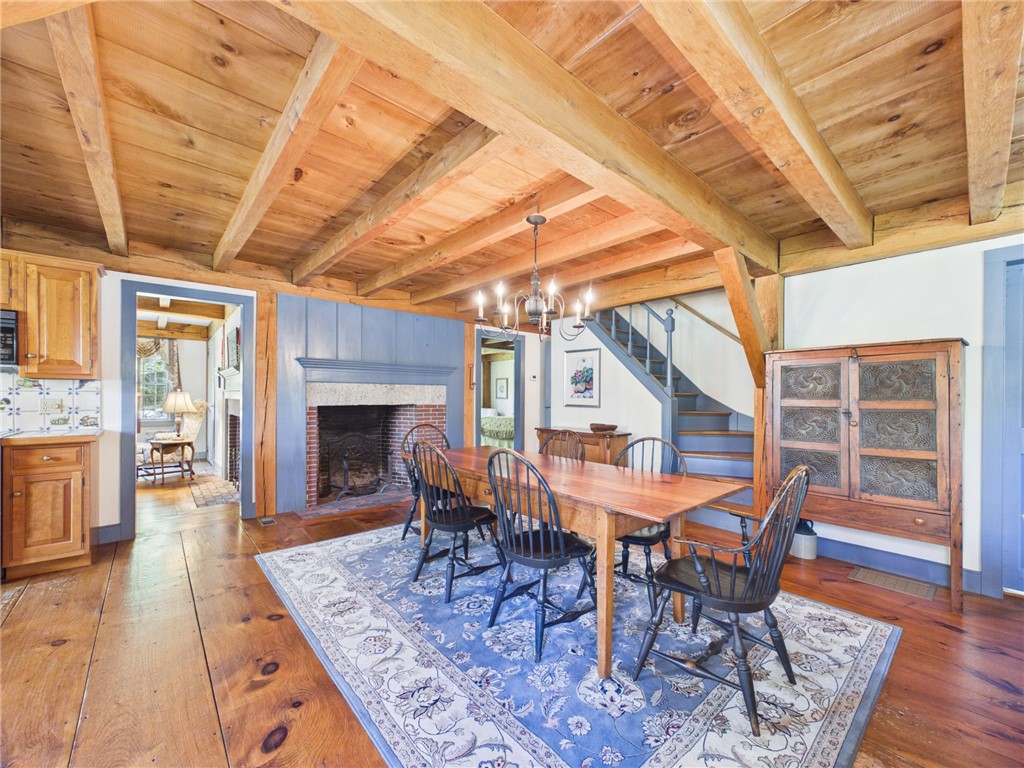 307 Stony Fort Road Saunderstown, RI 02874 - Photo 21 of 48 You can have a banquet in this open dining area just off the kitchen. Notice the wide pine floors throughout the first floor.