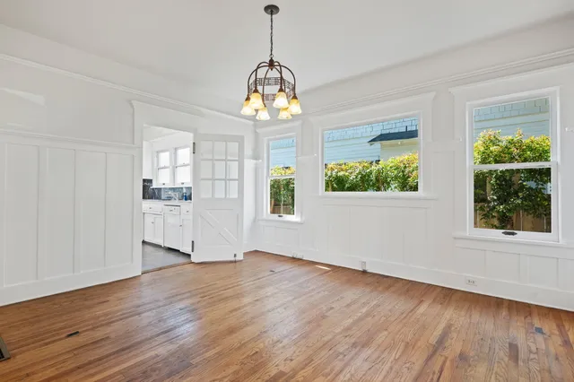 a view of an entryway with wooden floor