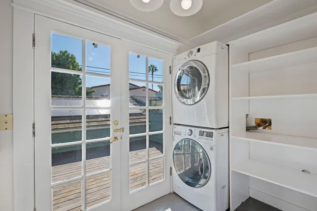 a view of a deck with table and chairs and wooden floor
