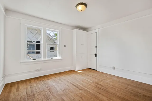 a living room with a couch and a rug