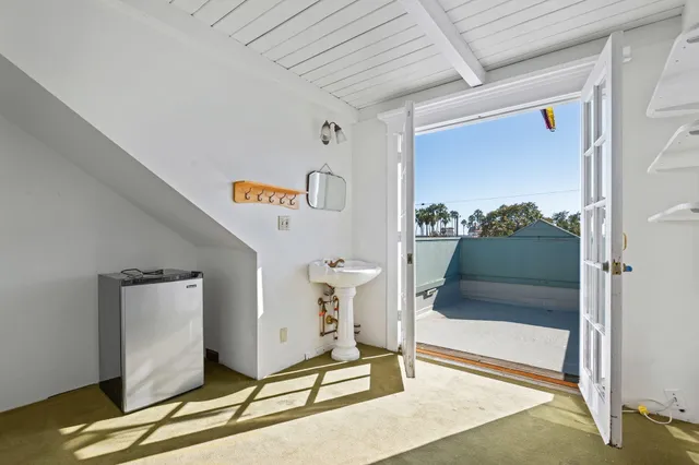 a view of a house with a yard and deck