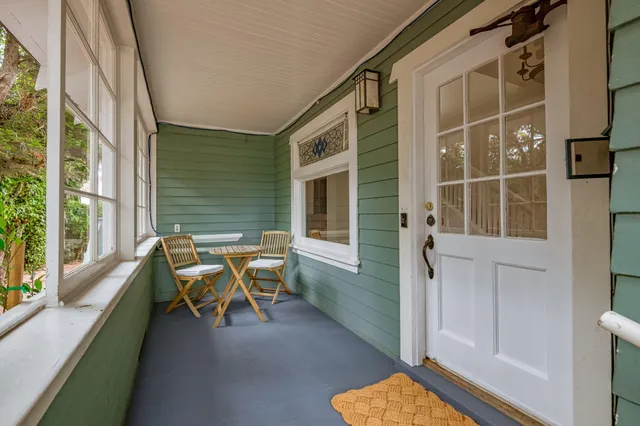 a view of empty room with fireplace and wooden floor