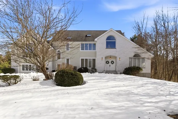 a view of a house with a snow in the yard