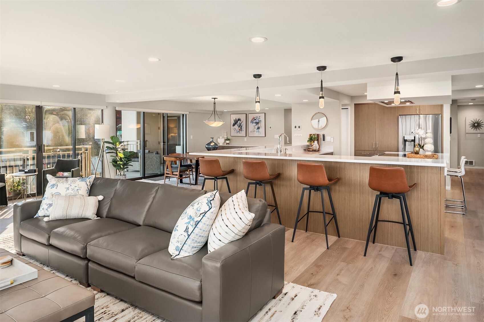 1111 Harbor Avenue Southwest, Unit 200 Seattle, WA 98116 - Photo 12 of 32 a living room with furniture and a view of kitchen