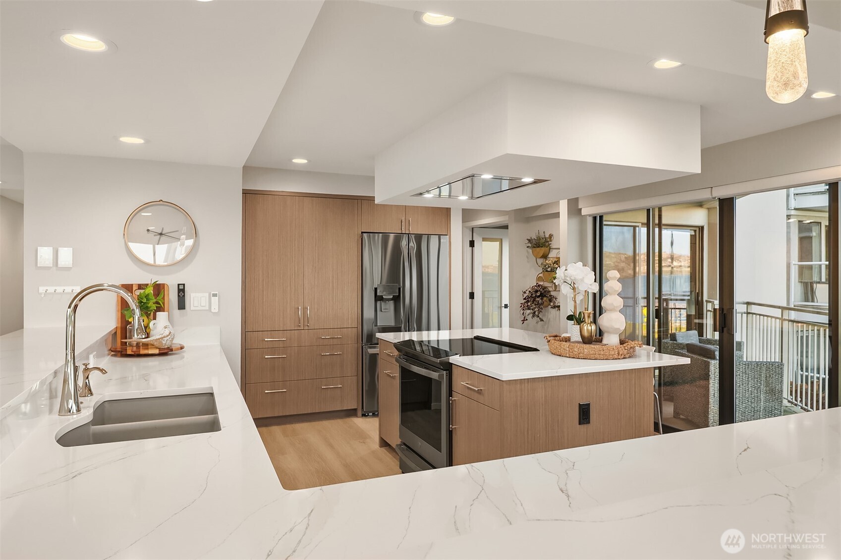 1111 Harbor Avenue Southwest, Unit 200 Seattle, WA 98116 - Photo 15 of 32 a kitchen with stainless steel appliances granite countertop a sink stove and refrigerator