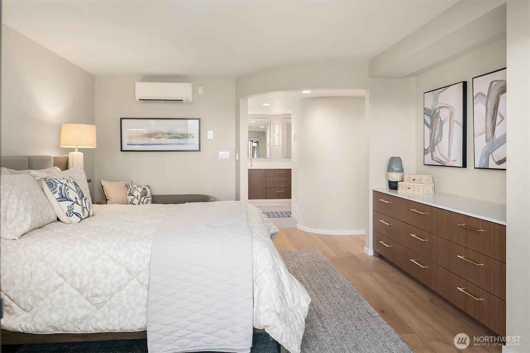 1111 Harbor Avenue Southwest, Unit 200 Seattle, WA 98116 - Photo 18 of 32 a bedroom with a bed and lamp