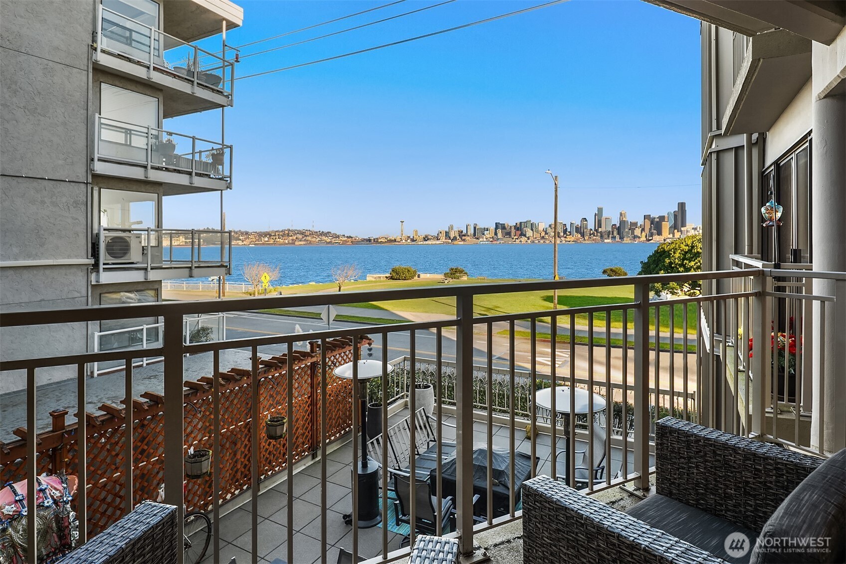 1111 Harbor Avenue Southwest, Unit 200 Seattle, WA 98116 - Photo 25 of 32 a view of roof deck with wooden fence and city view