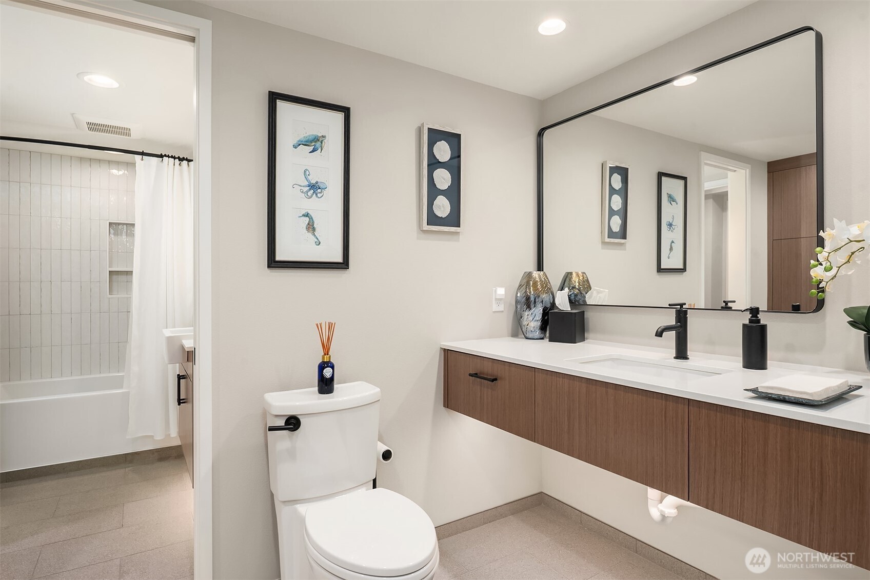 1111 Harbor Avenue Southwest, Unit 200 Seattle, WA 98116 - Photo 27 of 32 a bathroom with a sink a toilet and shower