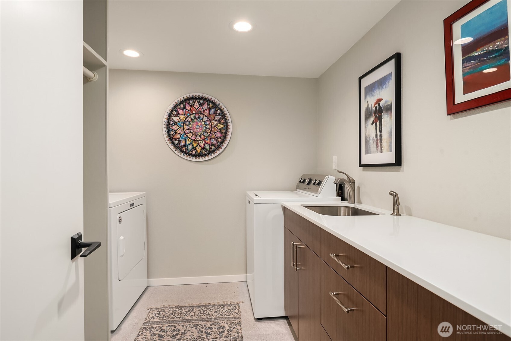 1111 Harbor Avenue Southwest, Unit 200 Seattle, WA 98116 - Photo 28 of 32 a bathroom with a sink and a mirror