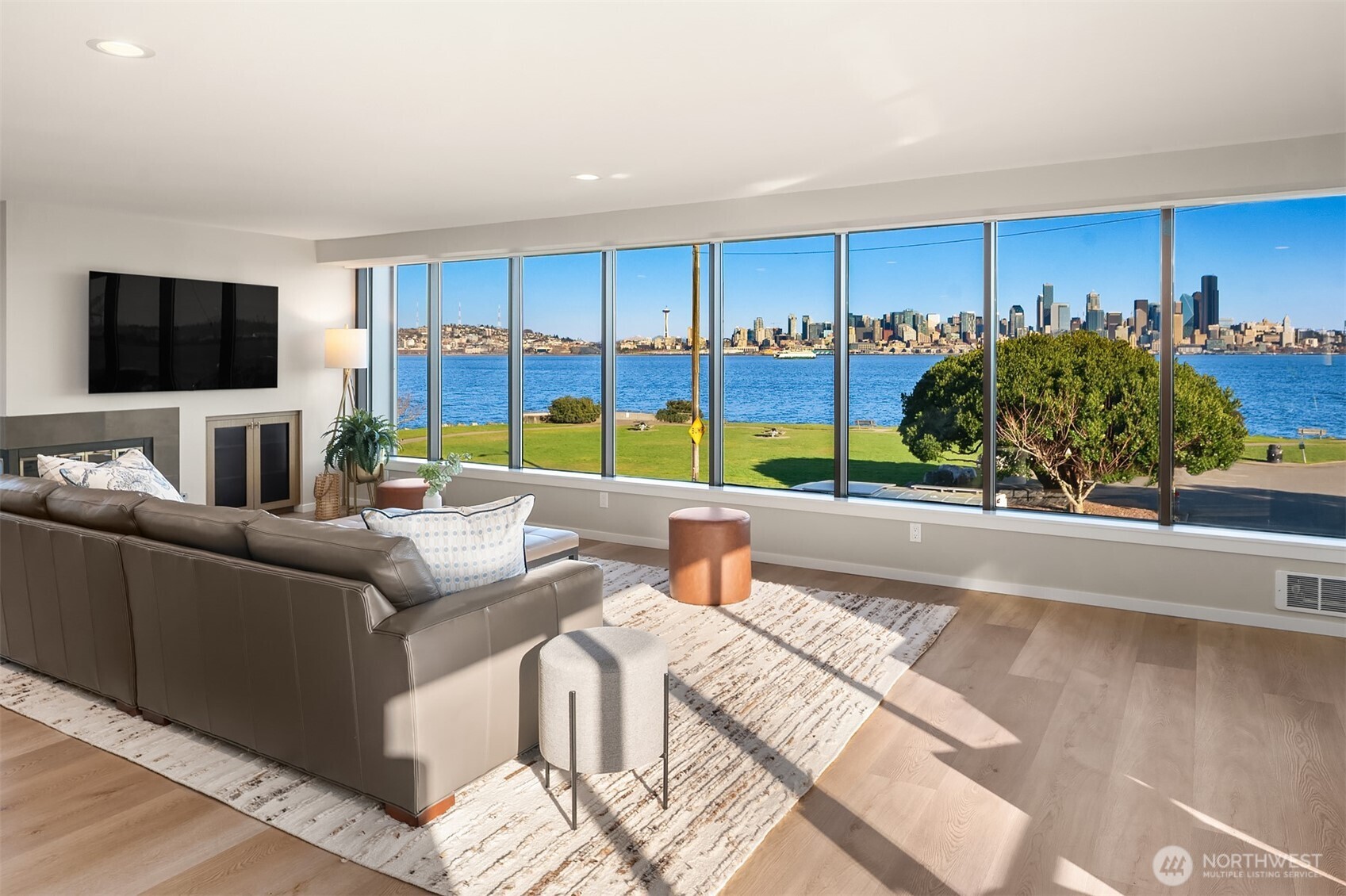 1111 Harbor Avenue Southwest, Unit 200 Seattle, WA 98116 - Photo 8 of 32 a living room with furniture and a flat screen tv